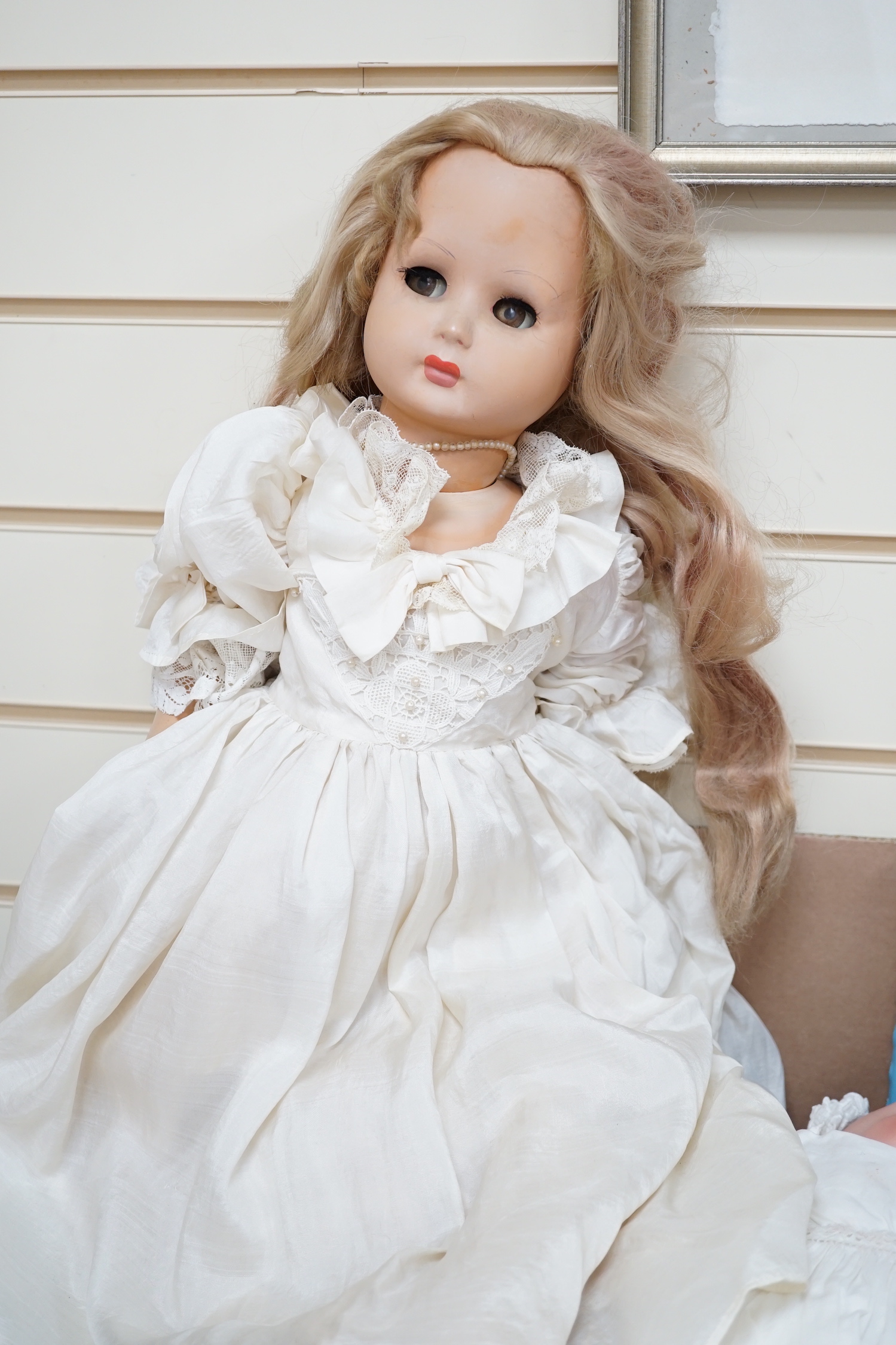 A German bent limb doll, height 63cm, hands damaged, vintage clothes, Cherie French doll's head on replaced new body, two hard plastic dolls, one Pedigree AM Dream Baby doll, soft body, small hard plastic baby in crib